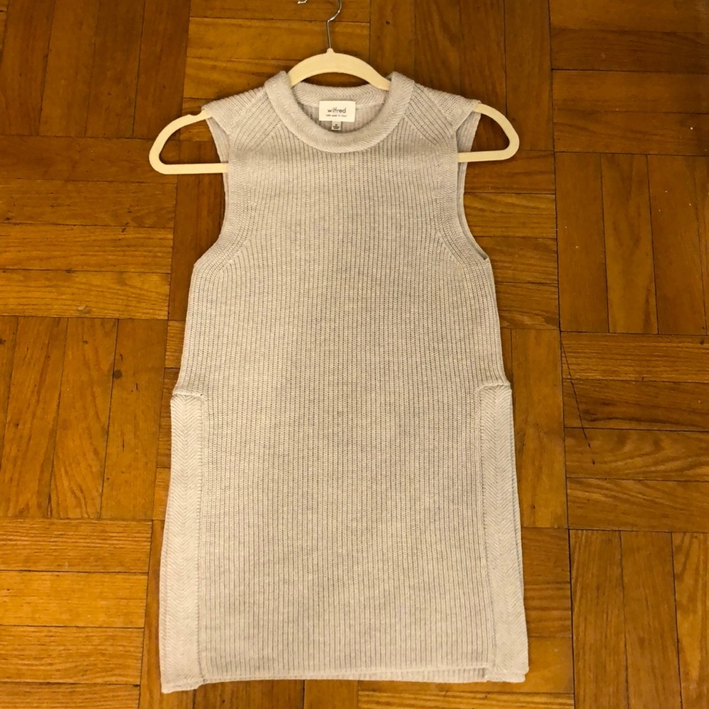 unworn sleeveless sweater with open sides